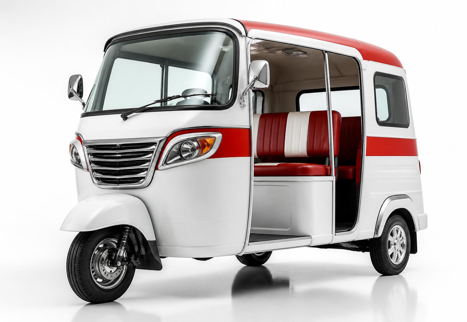 Sazgar passenger three-wheeler rickshaw in white and red, front three-quarter view